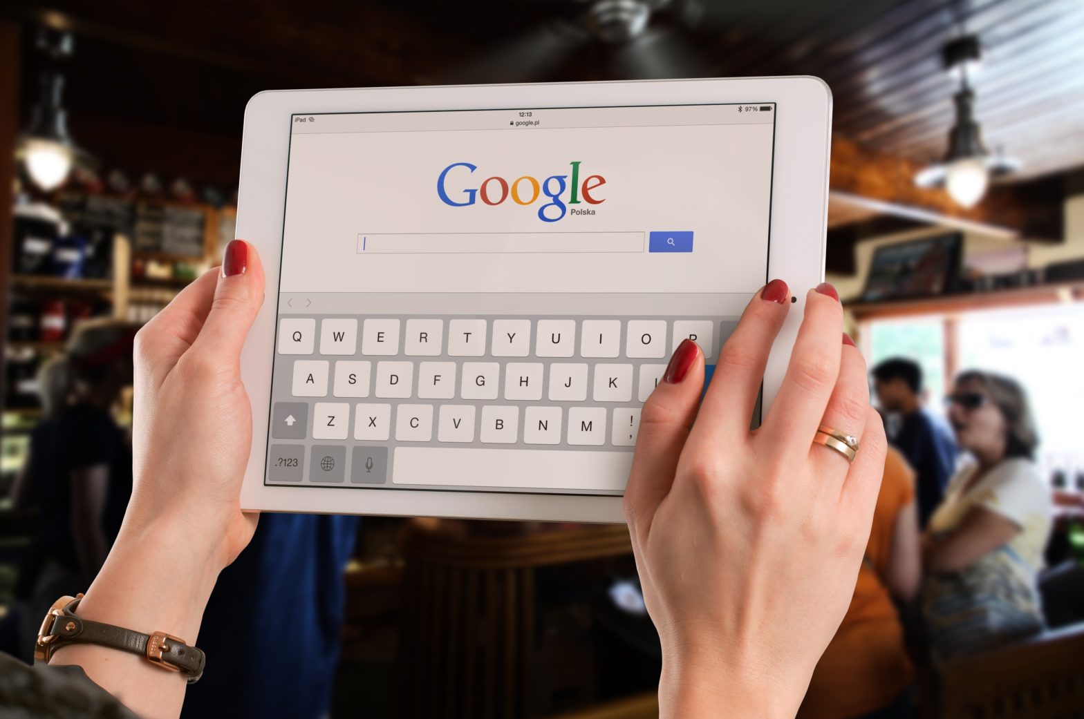 Photo of person googling on iPad: Can people find you on Google? (Or, do they find your competition first?)